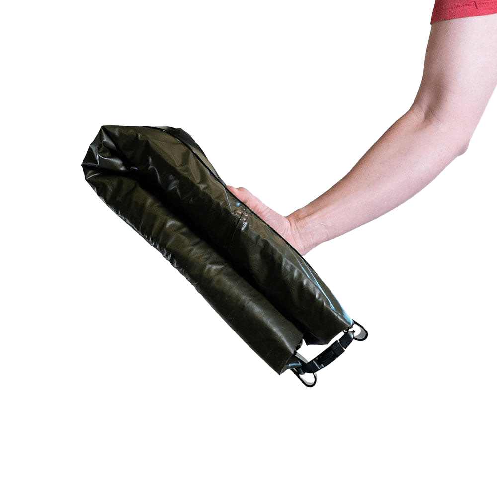 Lightweight Rapid Raft by Uncharted Supply Co. inflated on calm water for outdoor adventure and emergency use