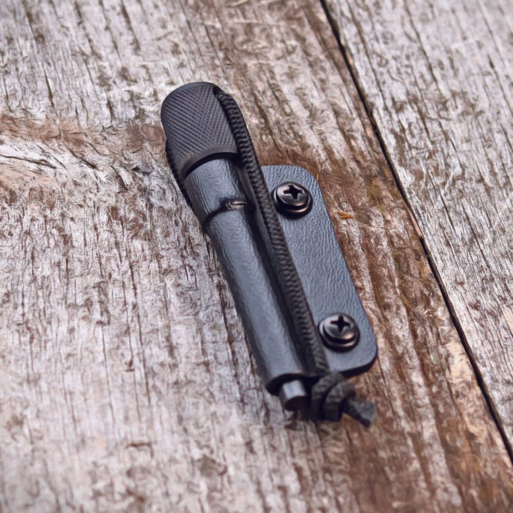 MSK-1 Firesteel Kit 2.0 with black aluminum handle and ferro rod in Kydex sheath for outdoor fire-starting