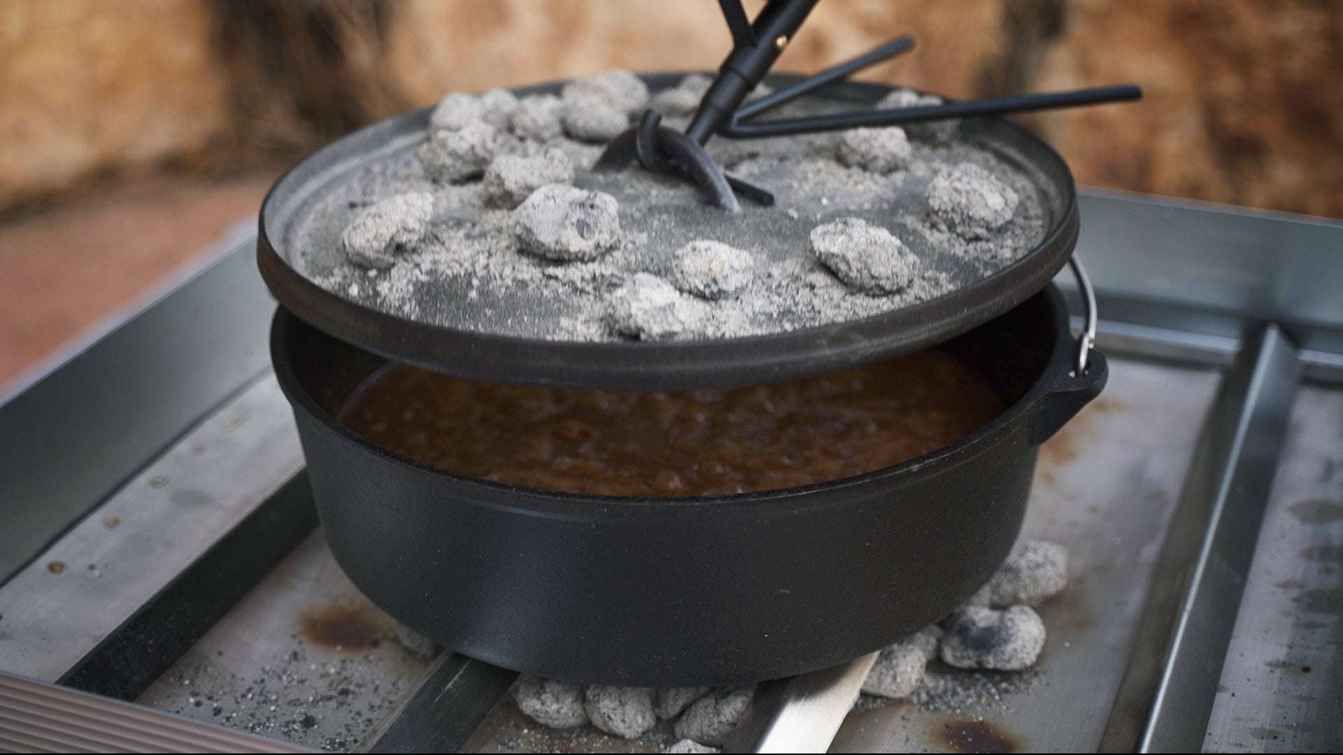 Frontier Grates Dutch oven accessory for 24" Pop-Up Pit made of durable stainless steel with V-Grates and locking rails for campfire cooking