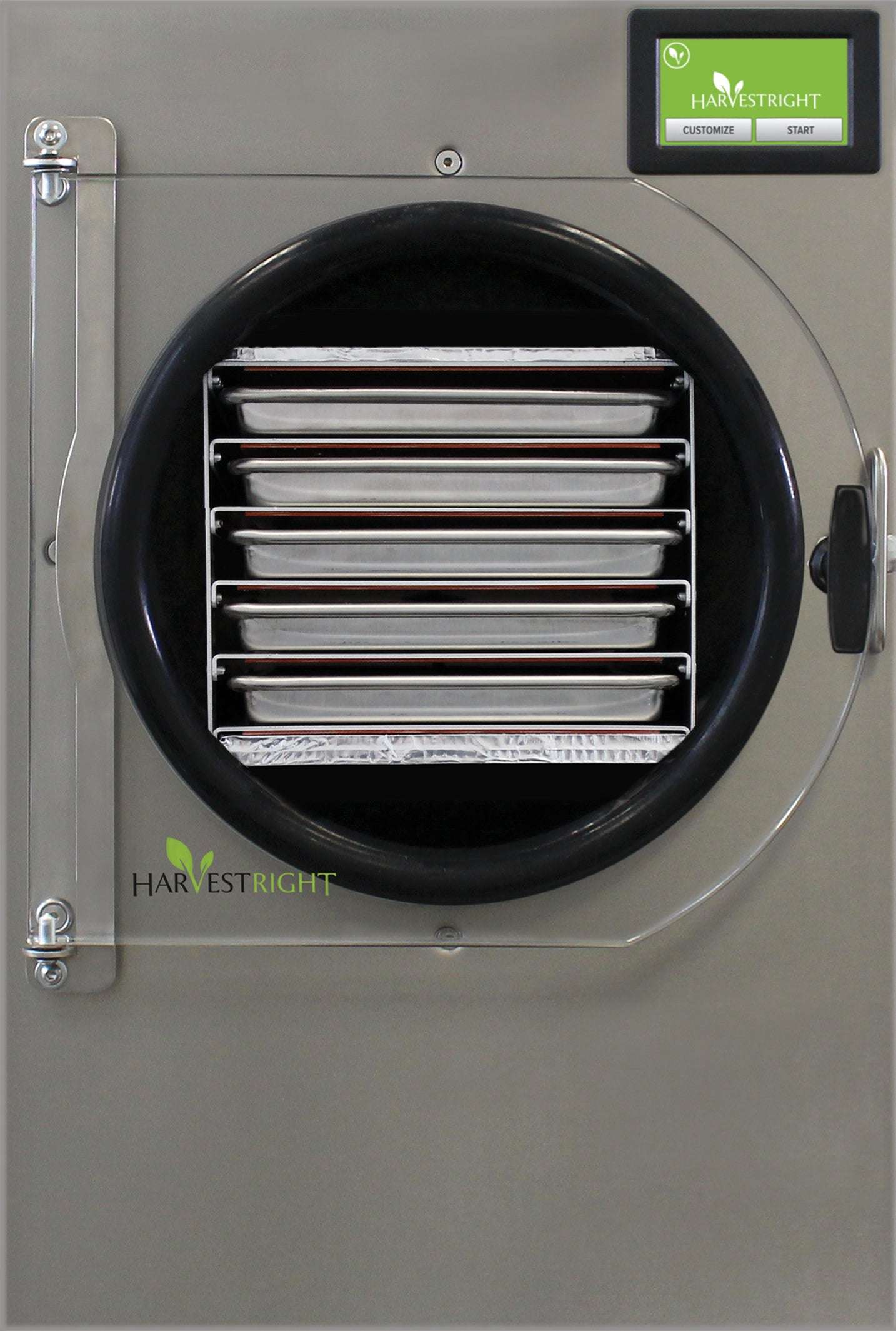 Small pharmaceutical stainless steel freeze dryer with vacuum pump and stainless steel trays.