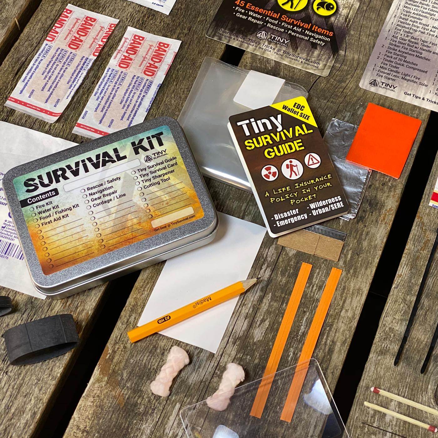 P-49 Elite Survival Kit bundle with 49 essential EDC survival items in a compact silver tin