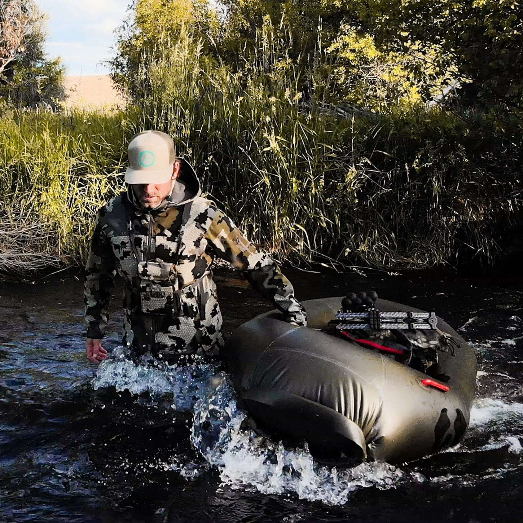 Lightweight Rapid Raft by Uncharted Supply Co. inflating for outdoor adventure use
