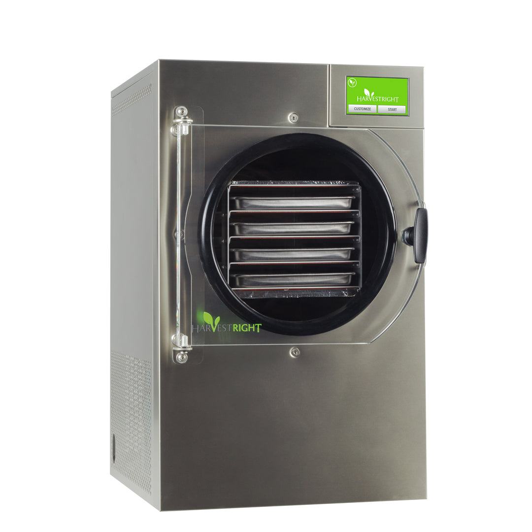small home freeze dryer stainless steel with trays and vacuum pump on countertop