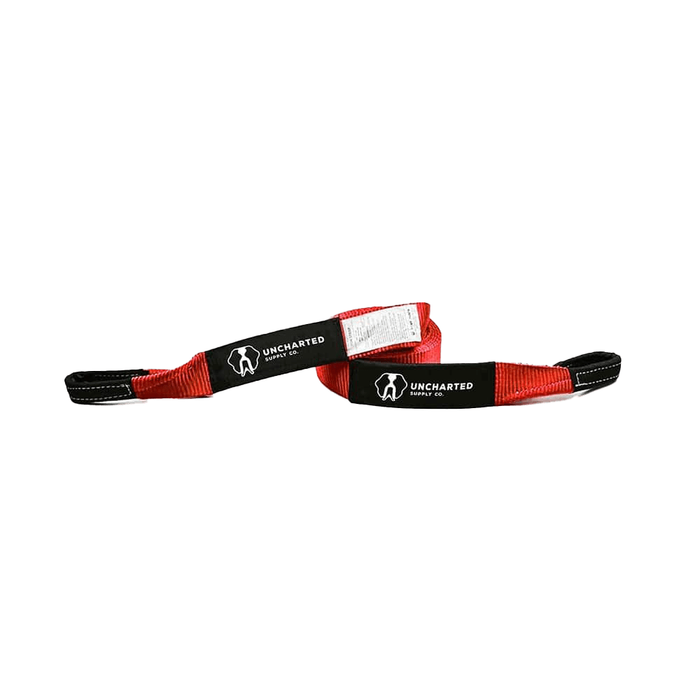 Heavy-duty red tow strap with reinforced loop end and printed instructions for vehicle recovery