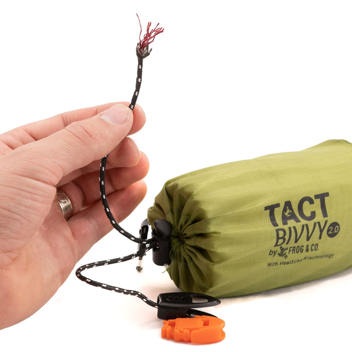Tact Bivvy® 2.0 ultralight emergency sleeping bag folded compactly with waterproof ripstop nylon and integrated survival whistle and paracord