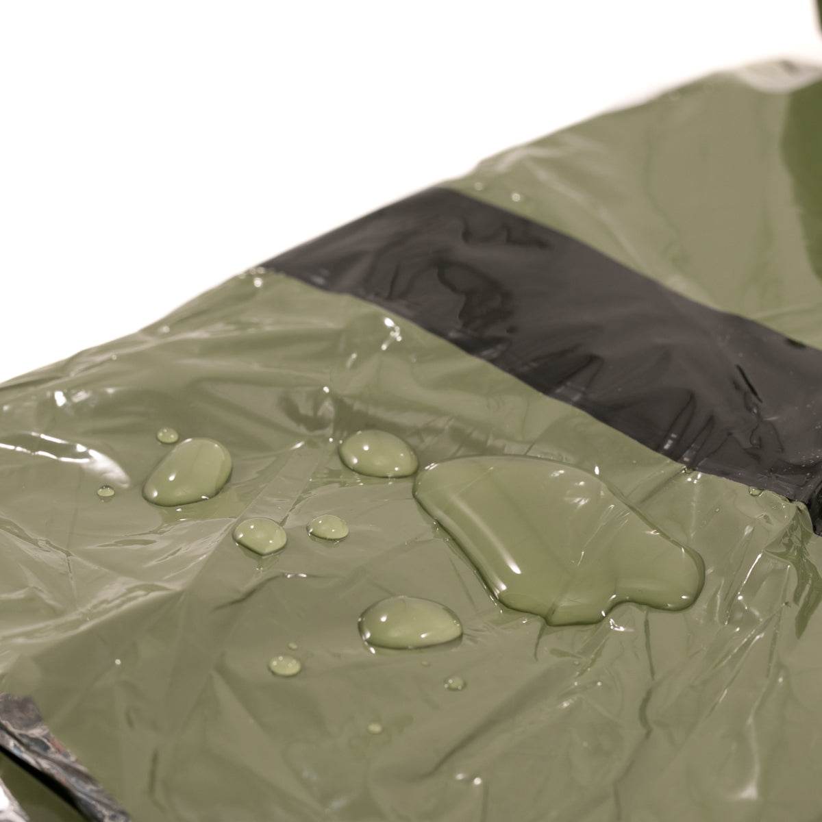 Tact Bivvy® 2.0 ultralight emergency sleeping bag folded compactly with waterproof ripstop nylon and integrated survival features
