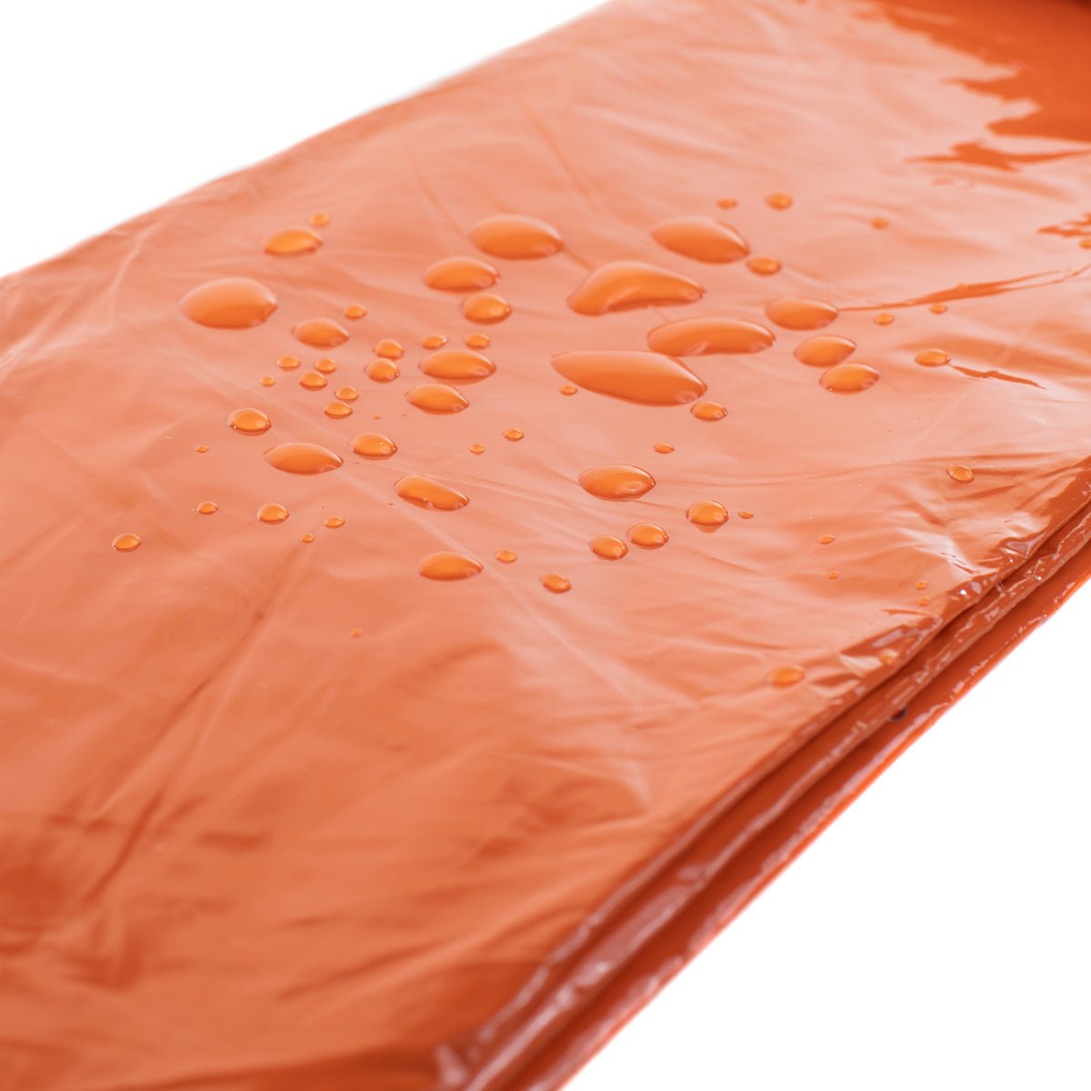 Tact Bivvy® 2.0 emergency sleeping bag folded compactly with waterproof ripstop nylon and survival gear features