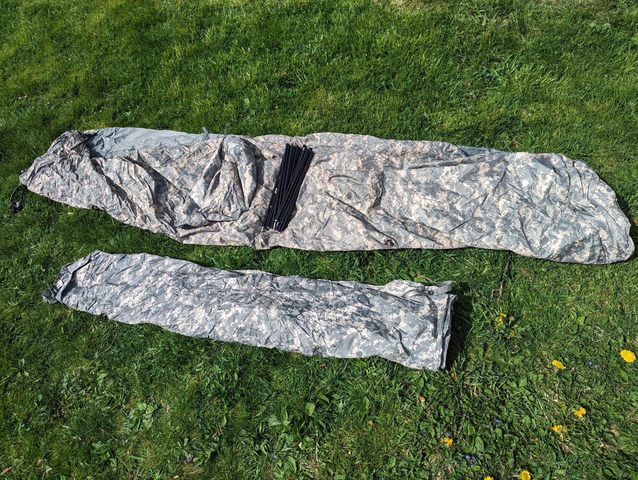 U.S. Military Improved Combat Shelter in ACU digital camouflage, waterproof tactical one-person tent with aluminum poles and full rainfly.