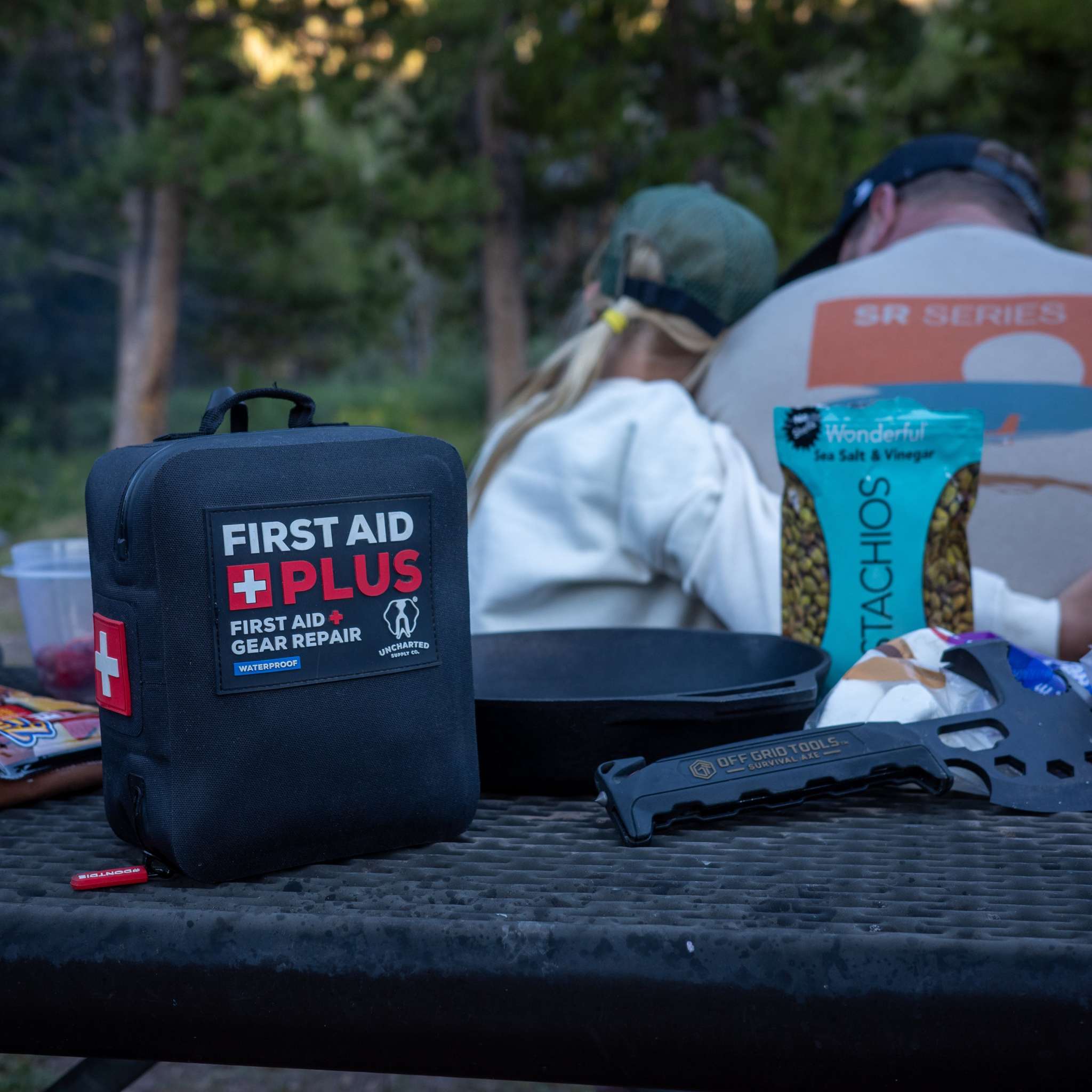 Uncharted Supply Co First Aid Plus waterproof kit combining medical supplies and repair tools for outdoor and emergency use
