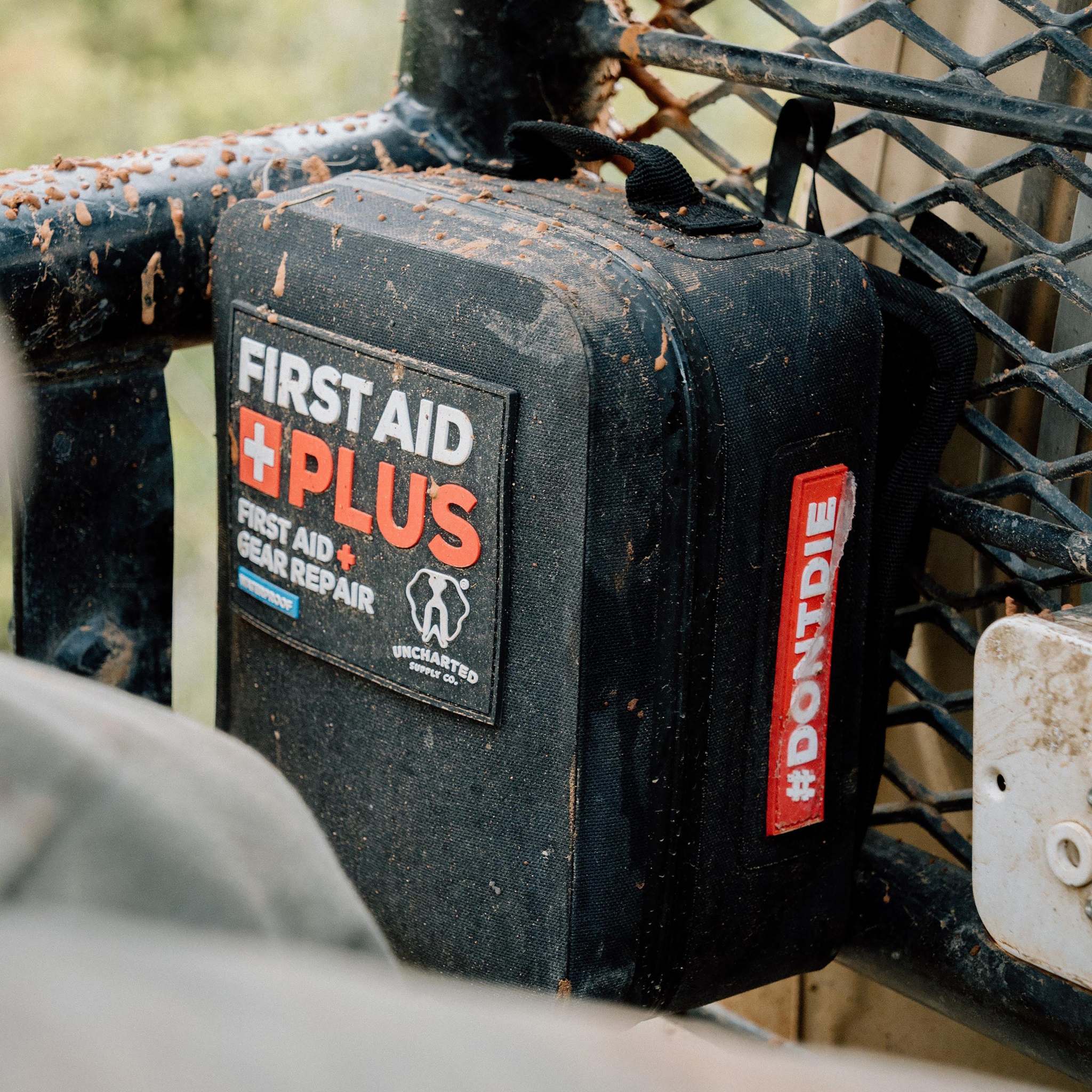 Uncharted Supply Co First Aid Plus rugged waterproof first aid and gear repair kit with tear-away MOLLE backer for outdoor and survival emergencies