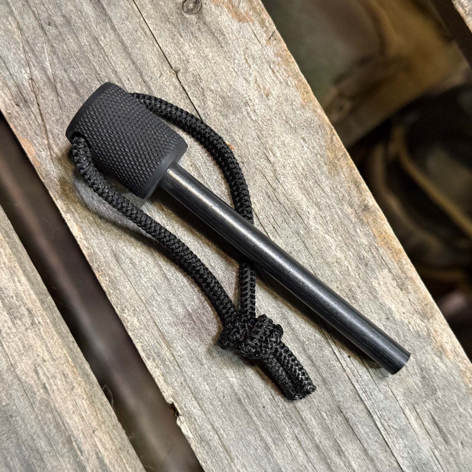 MSK-1 Firesteel Kit 2.0 with black aluminum handle and choice of Kydex or leather sheath for outdoor fire-starting