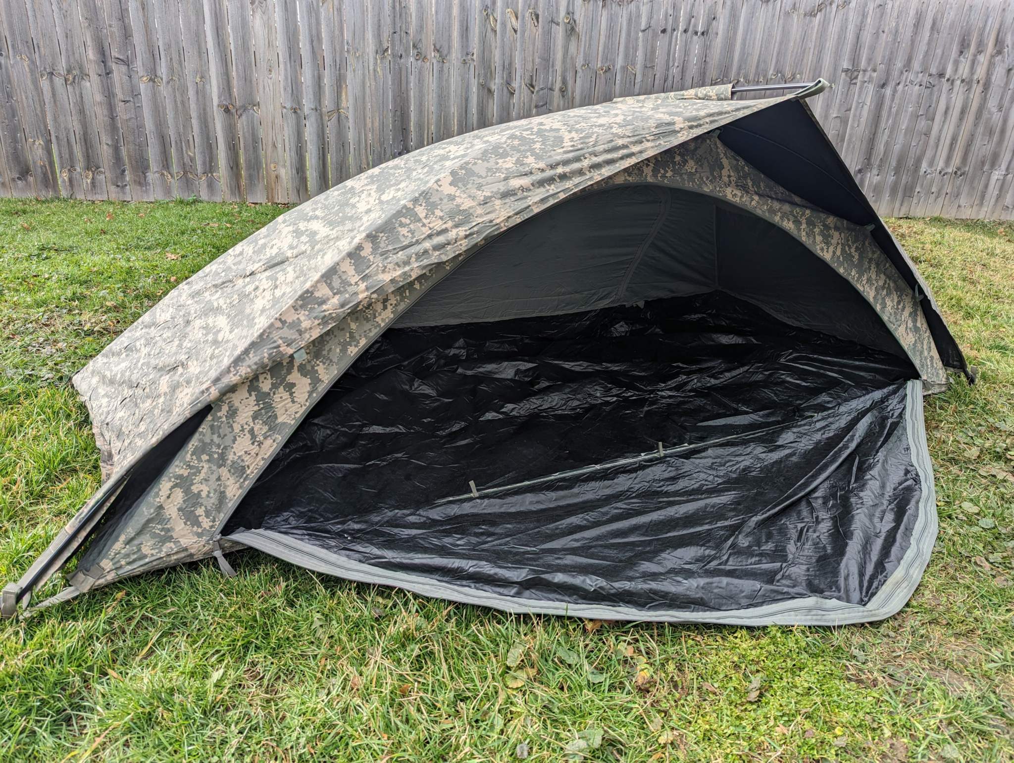 U.S. Military Improved Combat Shelter in ACU digital camouflage, one-person tactical tent with lightweight aluminum poles and waterproof breathable fabric