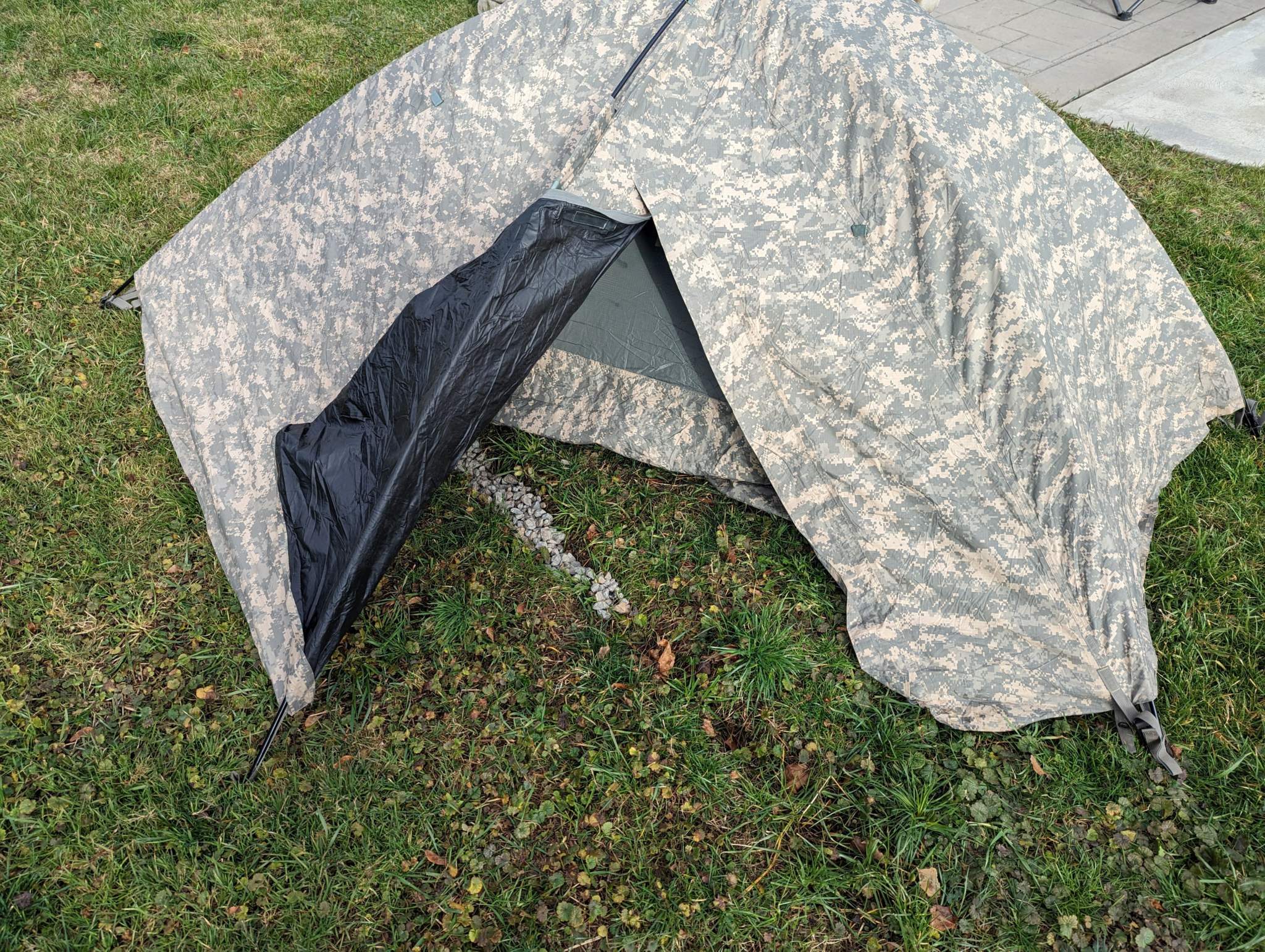 U.S. Military Improved Combat Shelter in ACU digital camouflage, one-person tactical tent with waterproof breathable fabric and lightweight aluminum frame