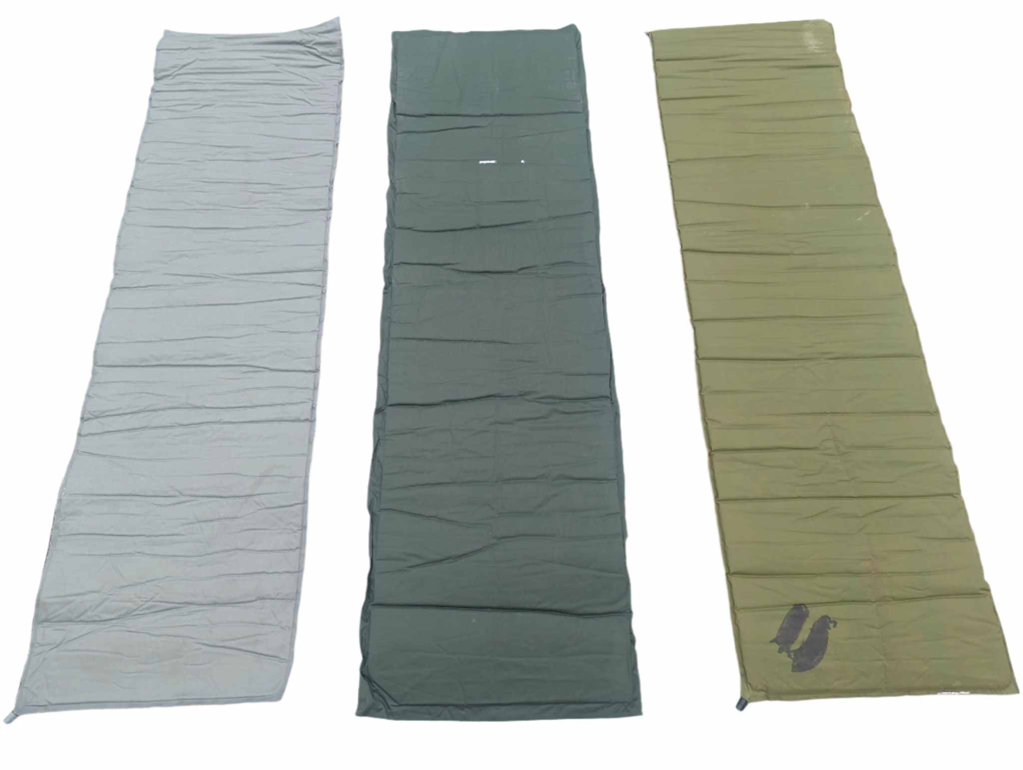 U.S. Military self inflating sleeping mat unrolled on the ground for camping and insulation